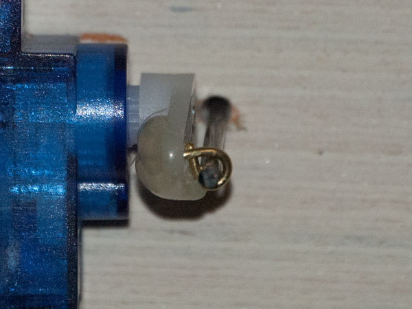 Here you can see how the brass wire is glued to the horn, and the turnout rod is threaded through the loop.